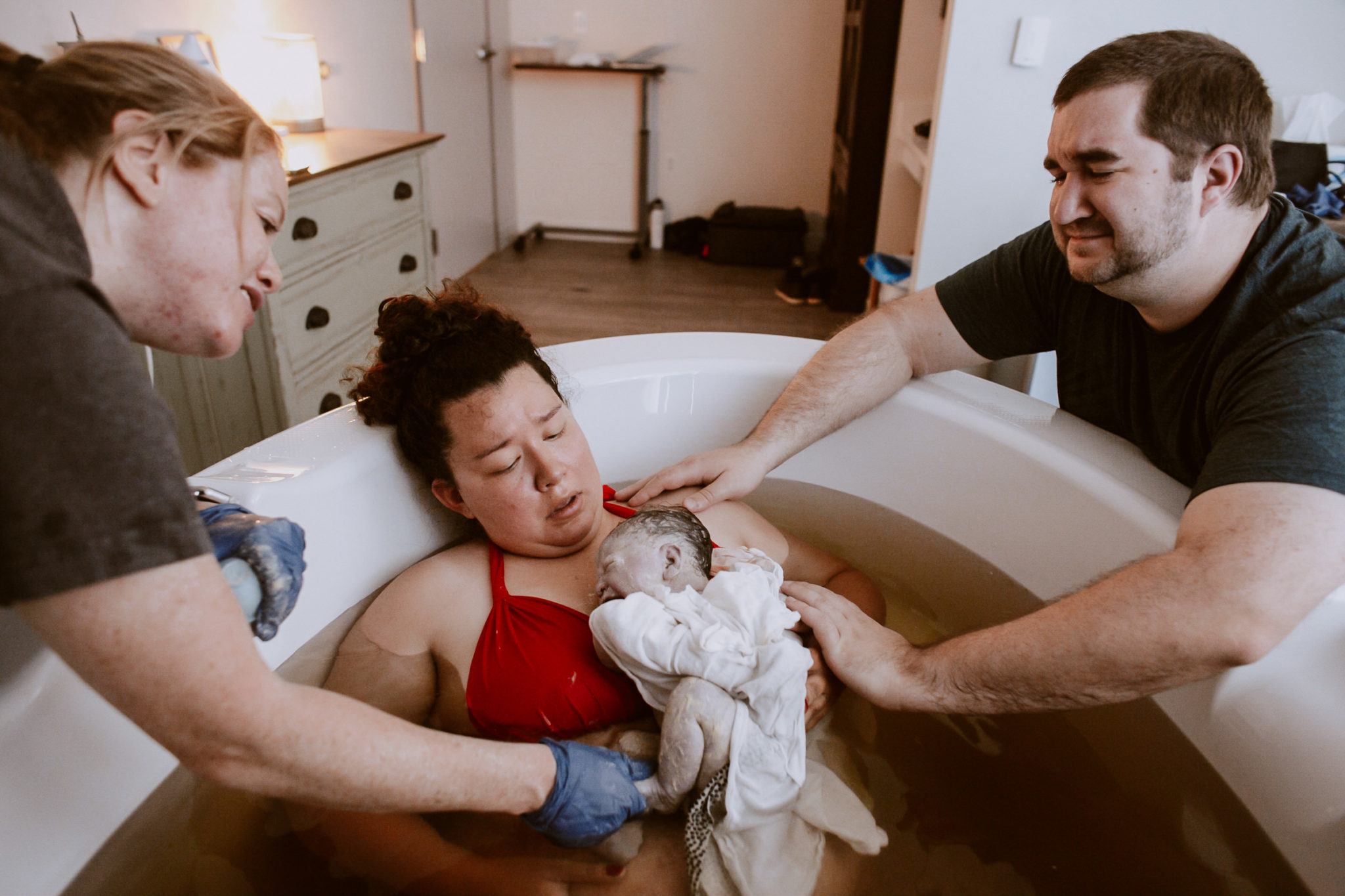 mother holding baby after water birth