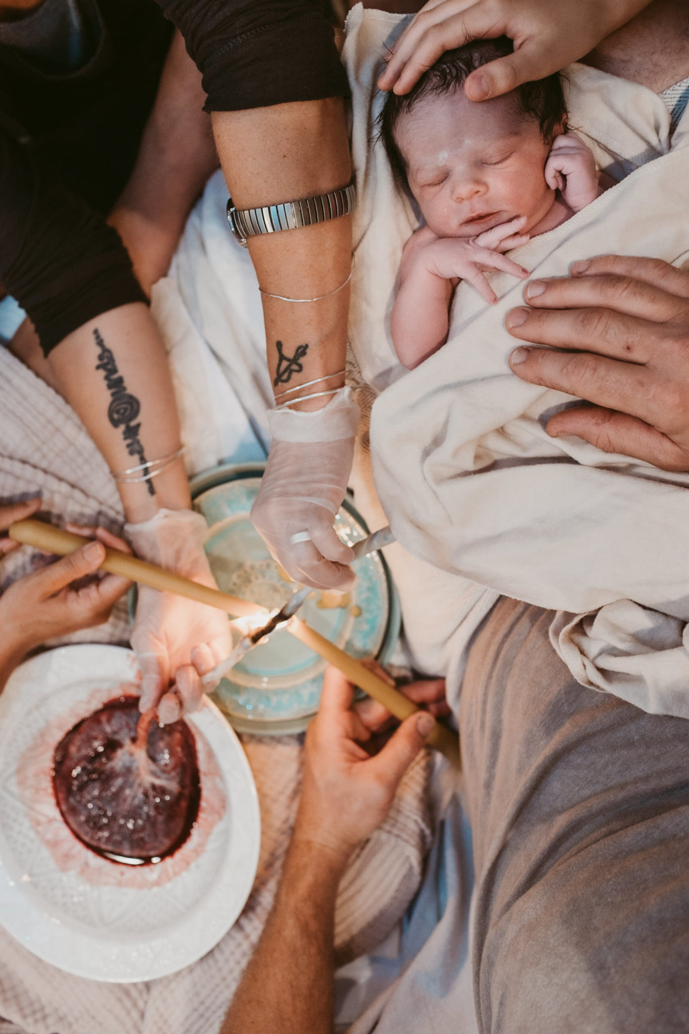 using candles to burn the cord after baby is born