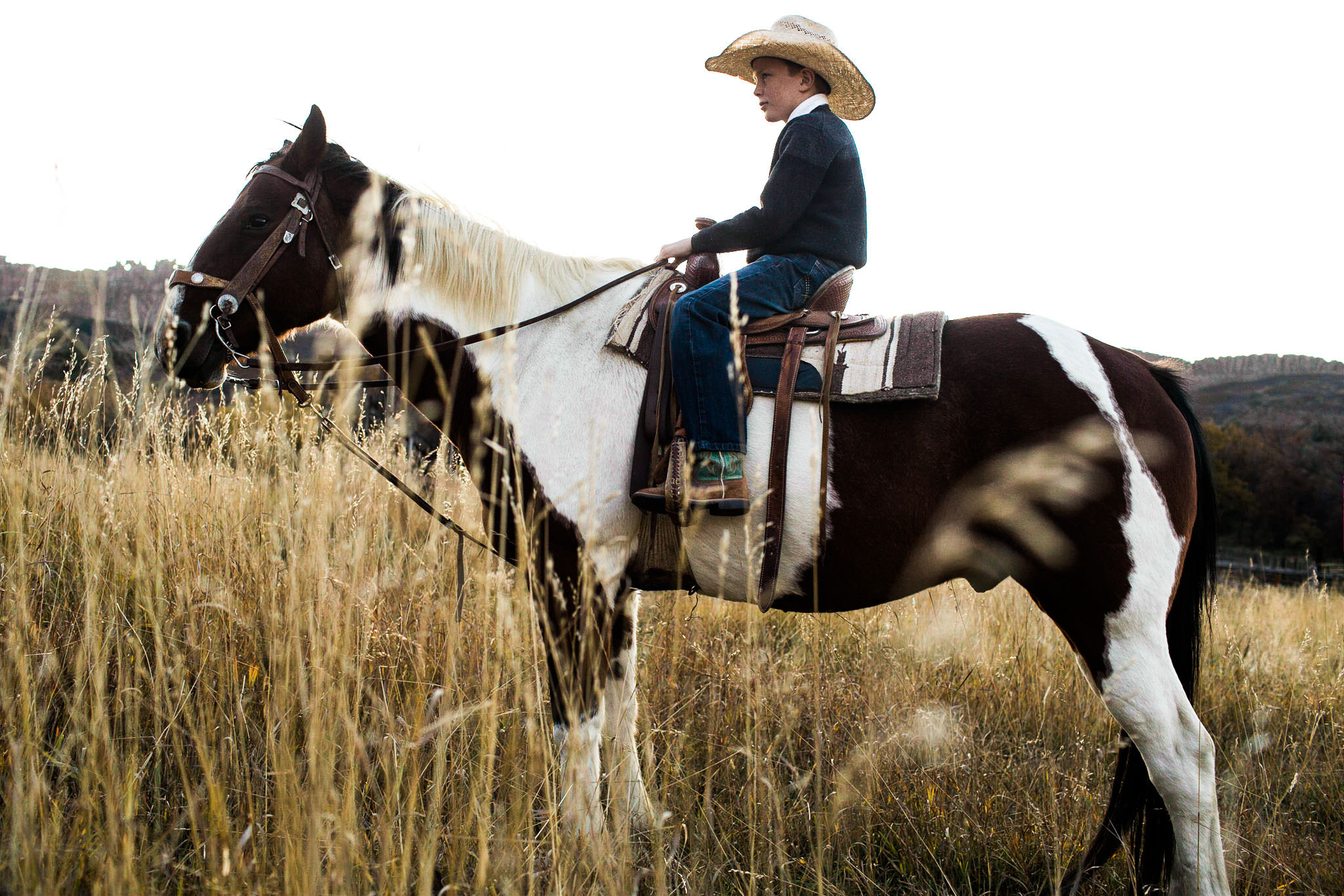 kid riding horse in colorado wild west